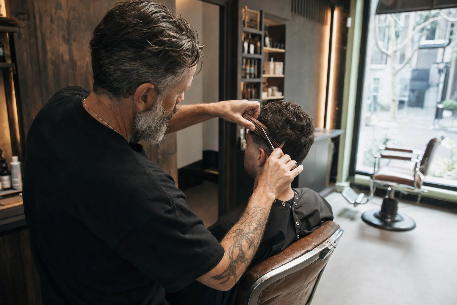 Illustrative reference showing a stylist applying hair colour